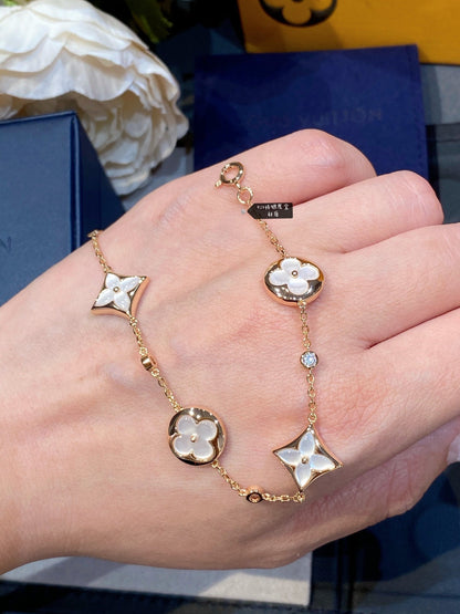[Regal Jewels]STAR AND SUN 4 MOTIF WHITE MOP PINK GOLD BRACELET